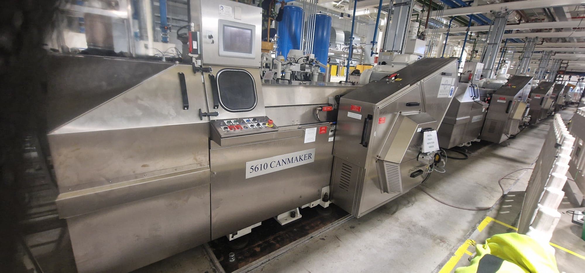 Row of canmaking machines along the production hall