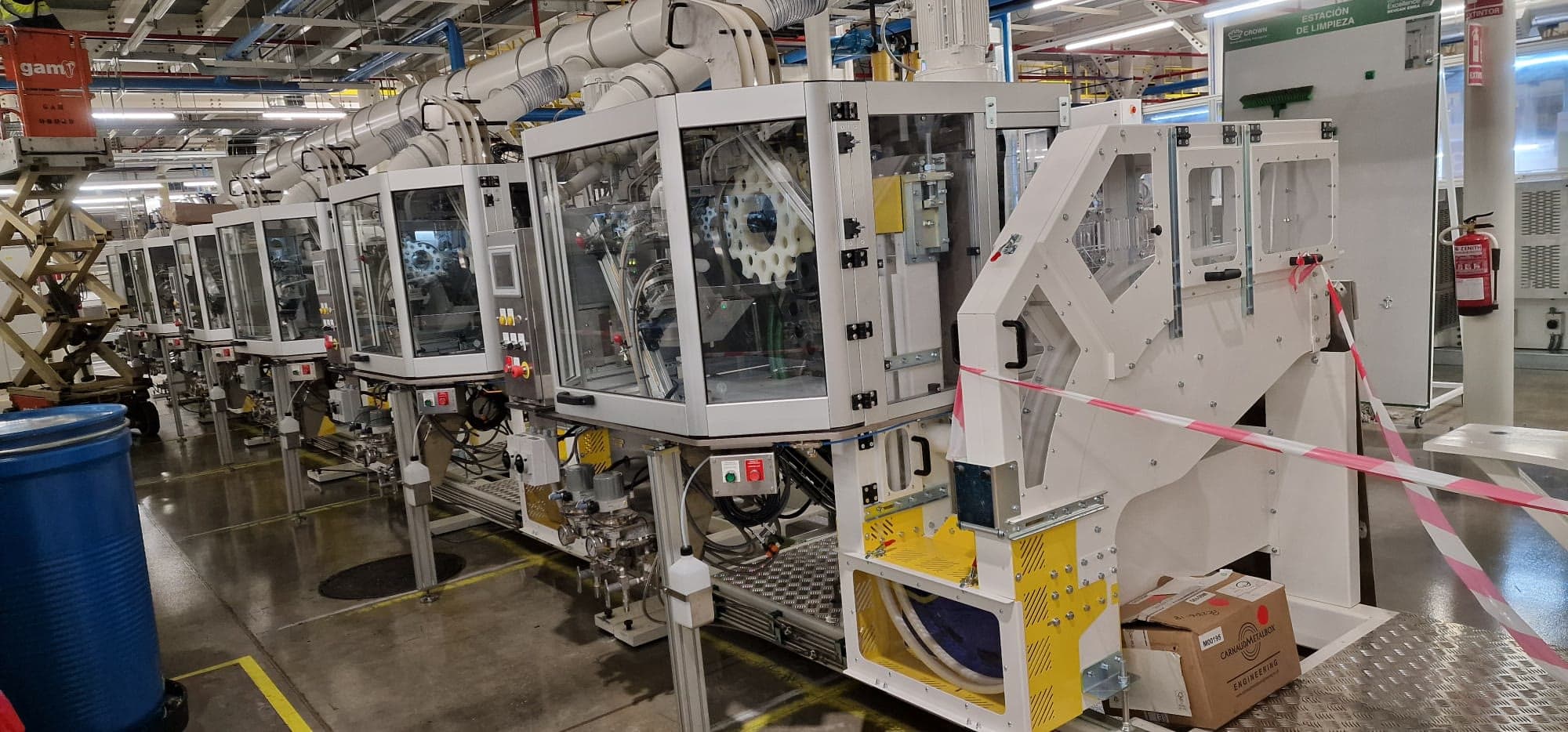 Guarded canmaking machines being set to work on the line