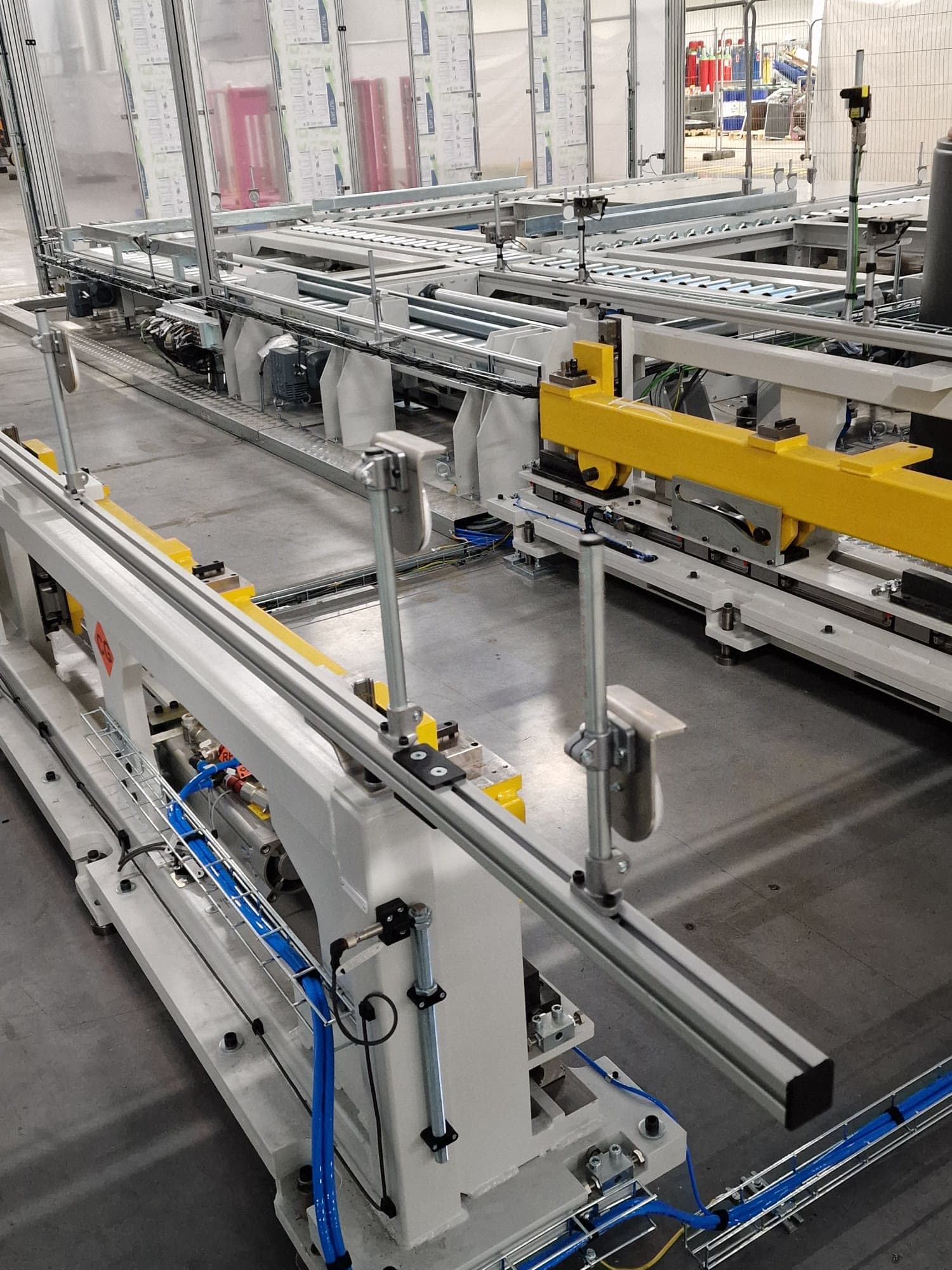 Conveyor frames and transfer beds on the assembly line